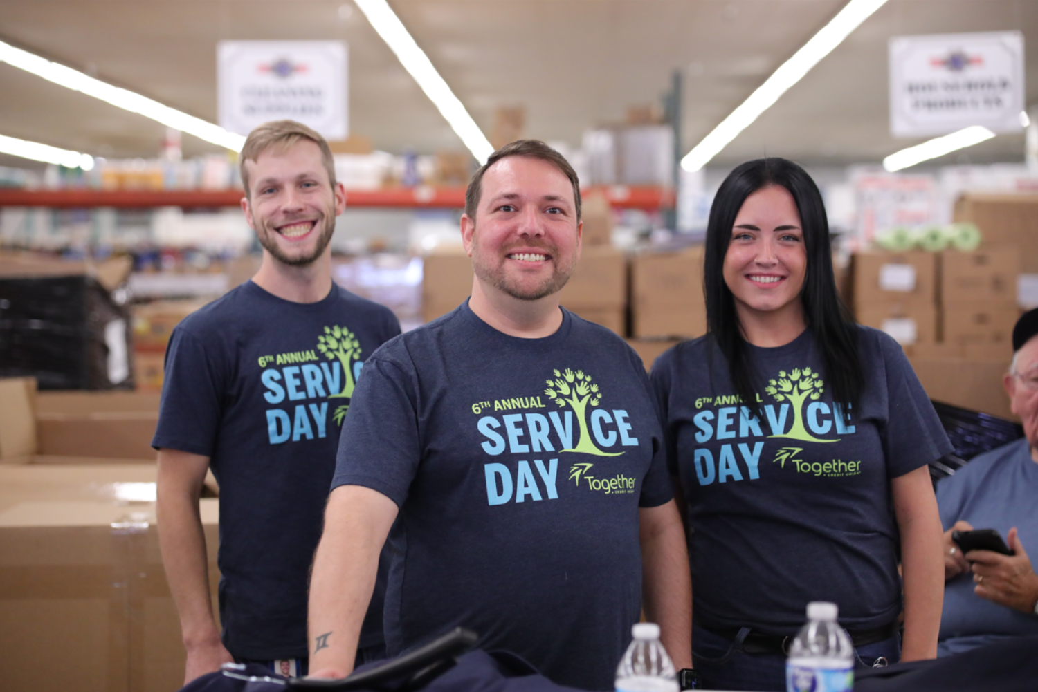group of team members smiling while volunteering
