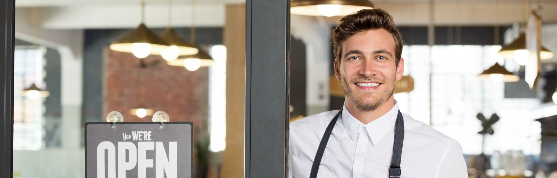 business owner with sign
