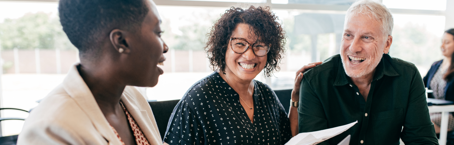 couple smiling in meeting with financial advisor